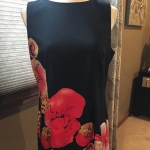 Black sleeveless dress with orange flowers
